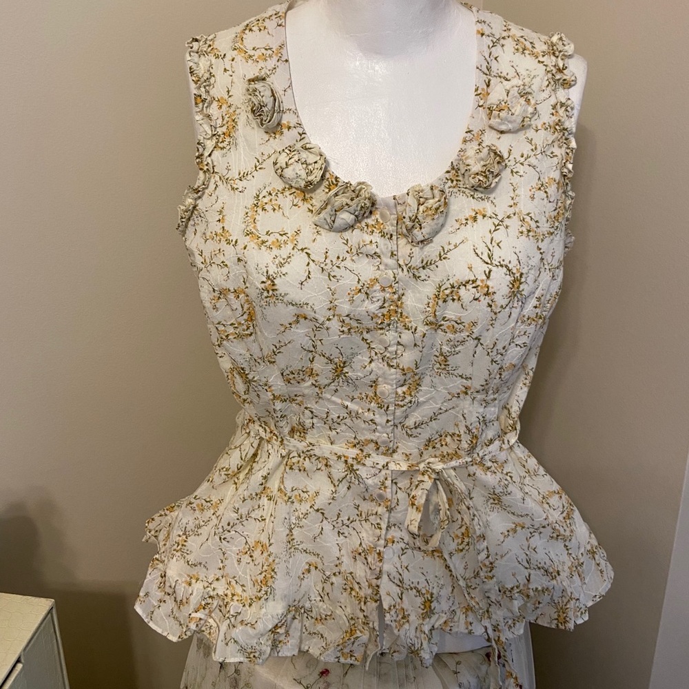 Beautiful top, but it runs a little small size 10